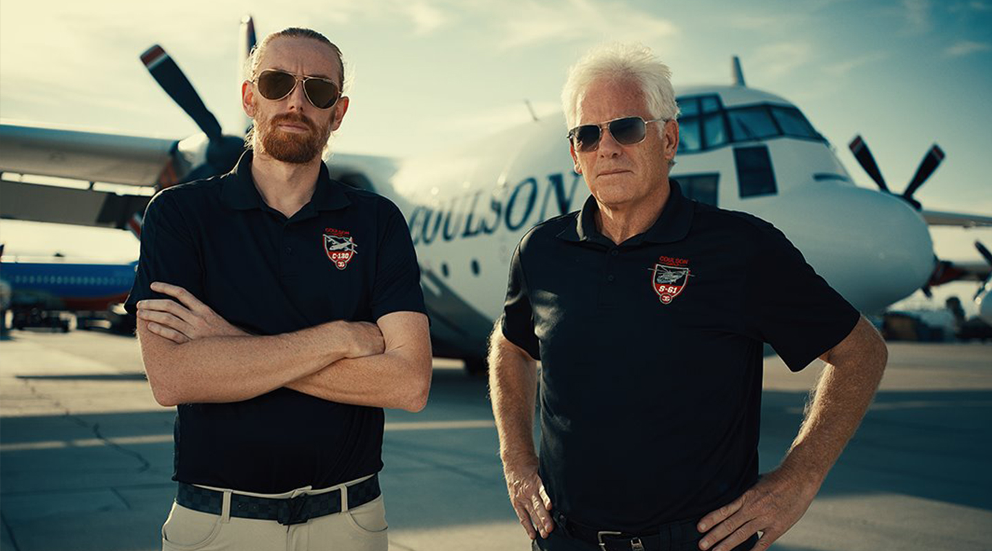 Britt and Wayne Coulson stand before their C-130 Hercules